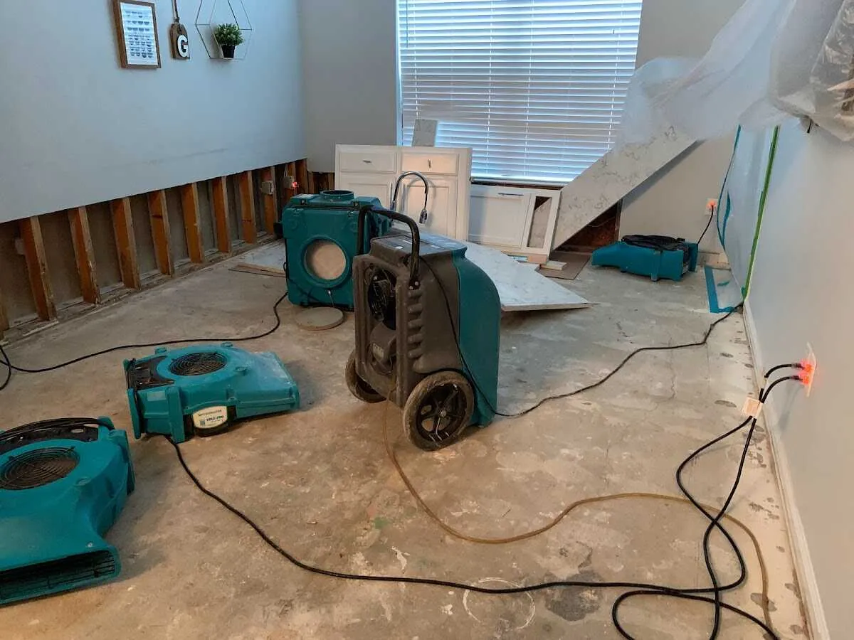 Dehumidifier in flood-cut room for Water Damage Restoration in Cushing